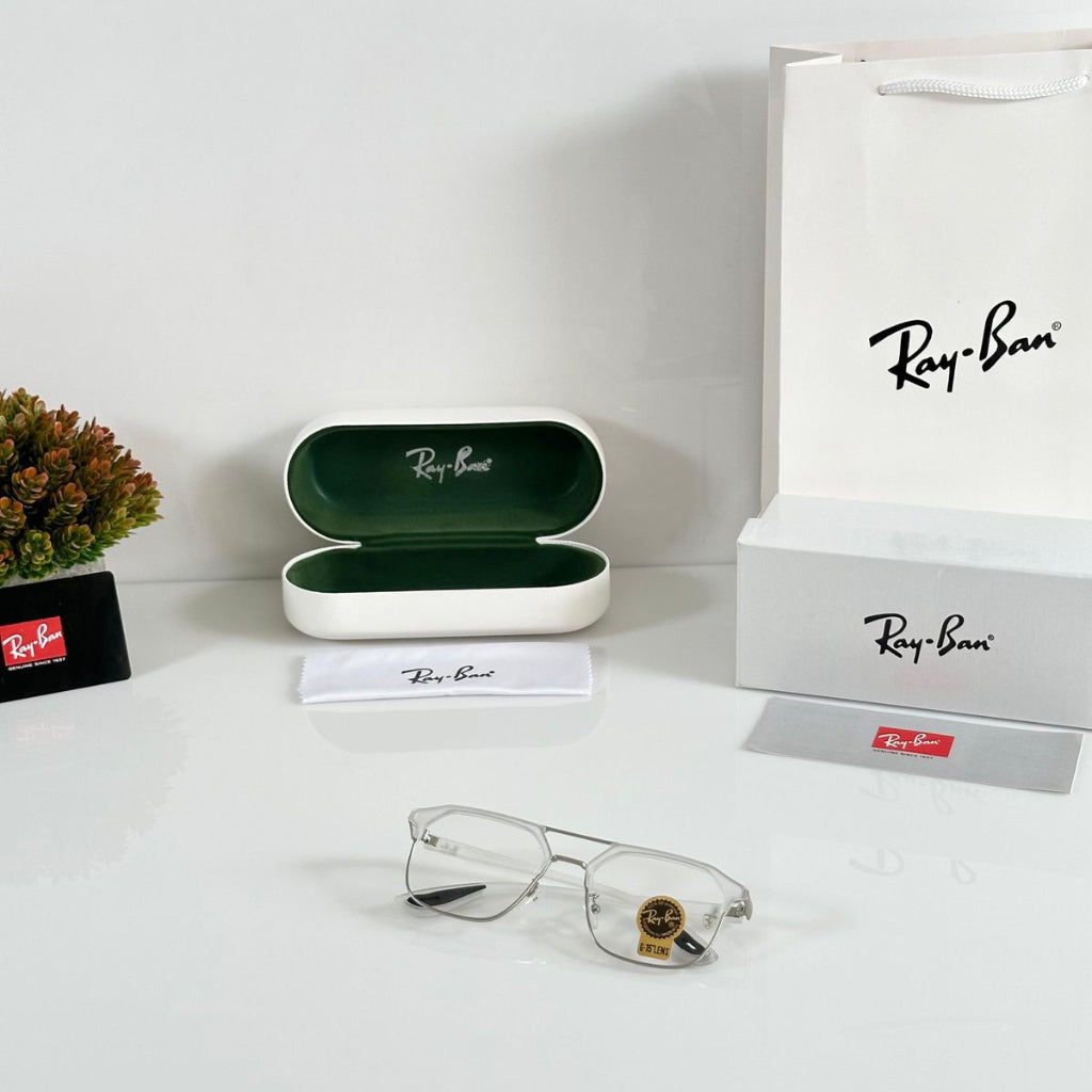 Ray-Ban eyeglasses with case and packaging on a white surface