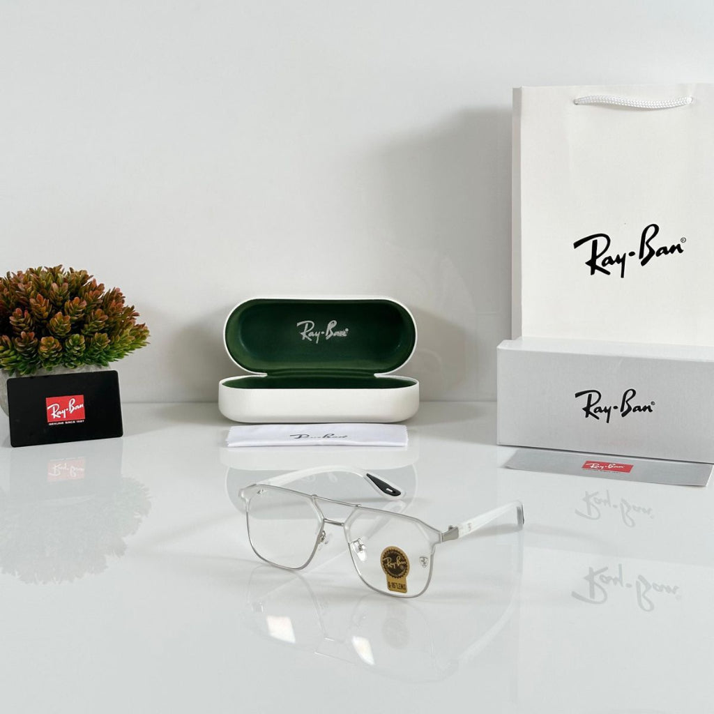 Ray-Ban eyeglasses with case and packaging on a white surface